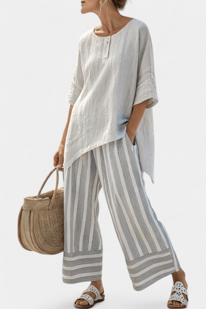 Set Blusa Asimmetrica Daisy e Pantaloni a Righe per un Look Chic e Contemporaneo