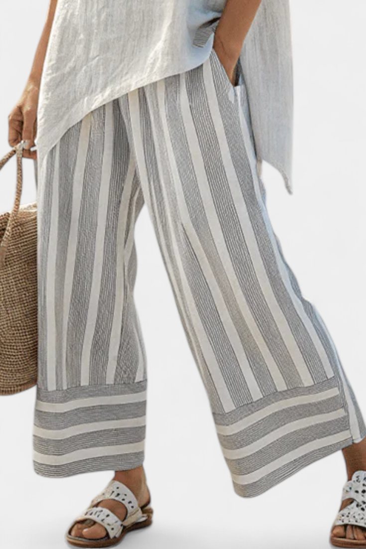 Set Blusa Asimmetrica Daisy e Pantaloni a Righe per un Look Chic e Contemporaneo