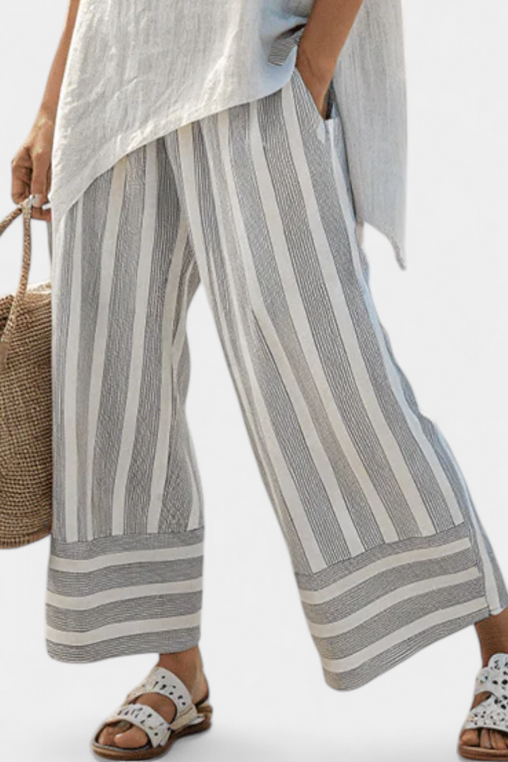 Set Blusa Asimmetrica Daisy e Pantaloni a Righe per un Look Chic e Contemporaneo